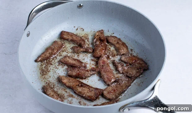 Flank steak in large skillet