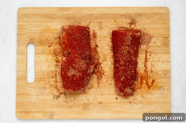 Spices mixed and applied to pork tenderloin