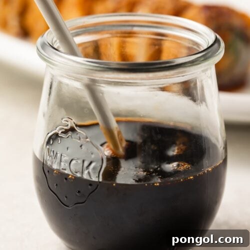 Eel sauce in a jar, showcasing its glossy, dark appearance