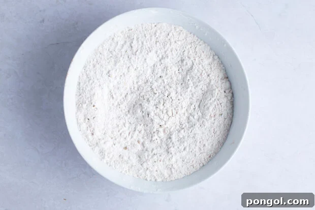 Vegan Fried Tofu Chik'n 8 Breading mixture in white bowl