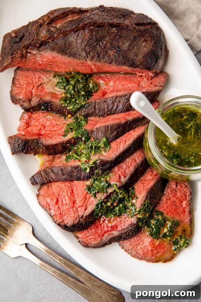 Perfectly cooked sous vide tri tip steak, sliced and ready to serve