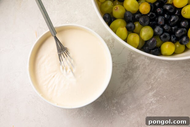 Sweet dressing mixture for grape salad being prepared