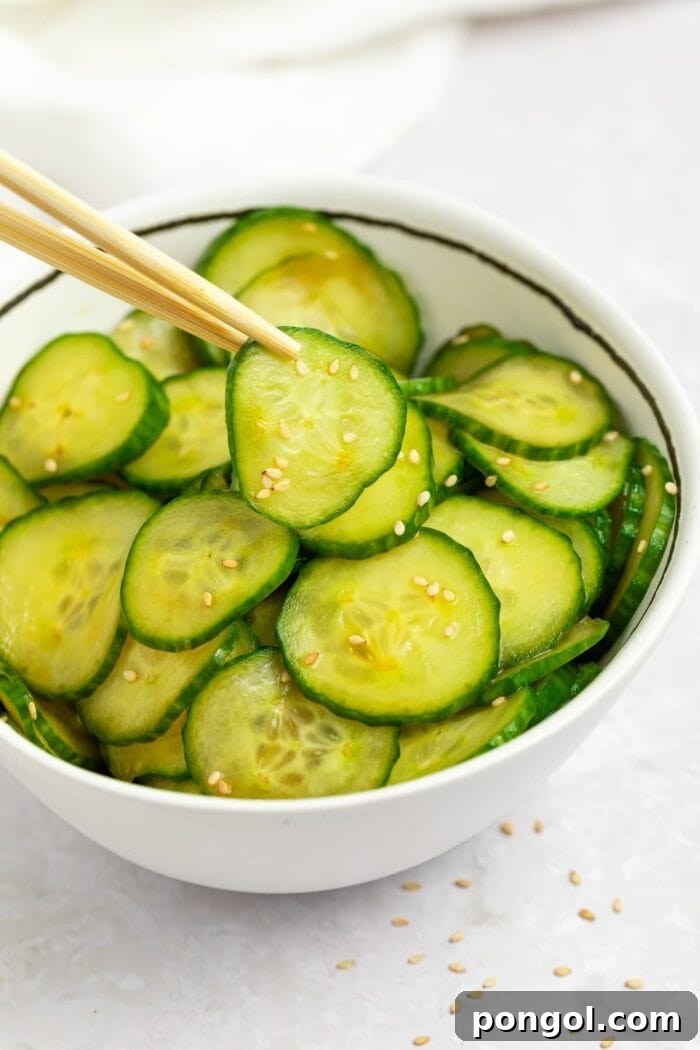 japanese cucumber salad in a bowl with chopsticks