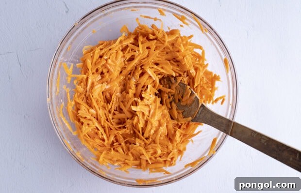 Sweet potato hash brown mixture in a large bowl, ready for frying