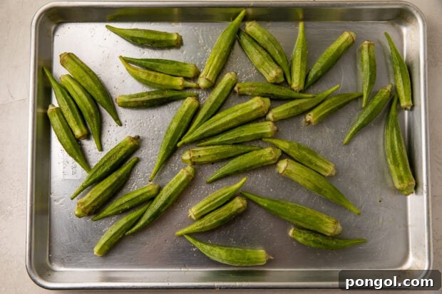 Raw fresh okra on baking sheet