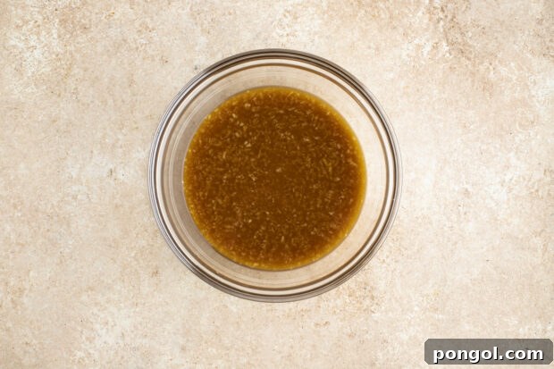 Sauce for pork stir fry in glass bowl