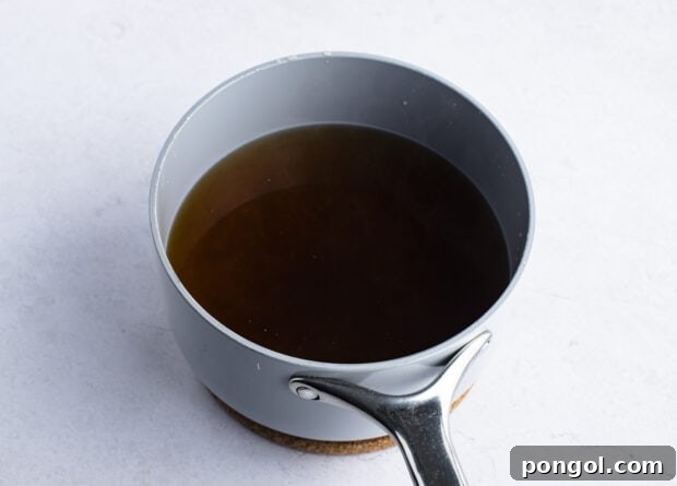 Udon soup broth in large pot