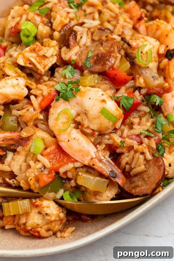 Instant Pot jambalaya served on a rustic platter, garnished with fresh cilantro, showcasing its rich texture and vibrant colors.