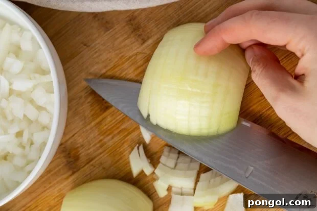 Make horizontal angled cuts following the onion's curve