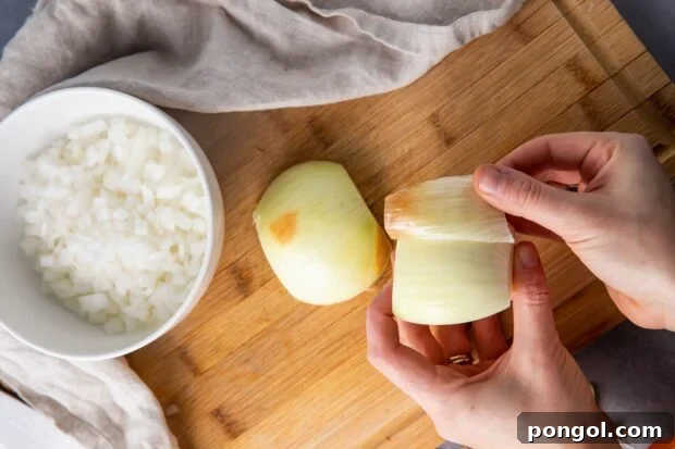 Peel away the outer layer of the onion halves