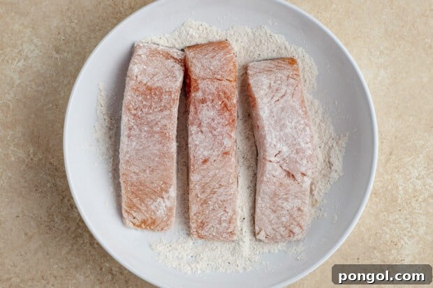 Salmon fillets in flour mixture