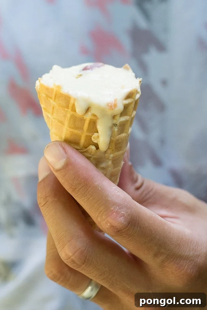 Sun-Kissed Vegan Peach Bliss 11 Two melting vegan peach ice cream cones, suggesting shared enjoyment and the irresistible nature of this summer treat.