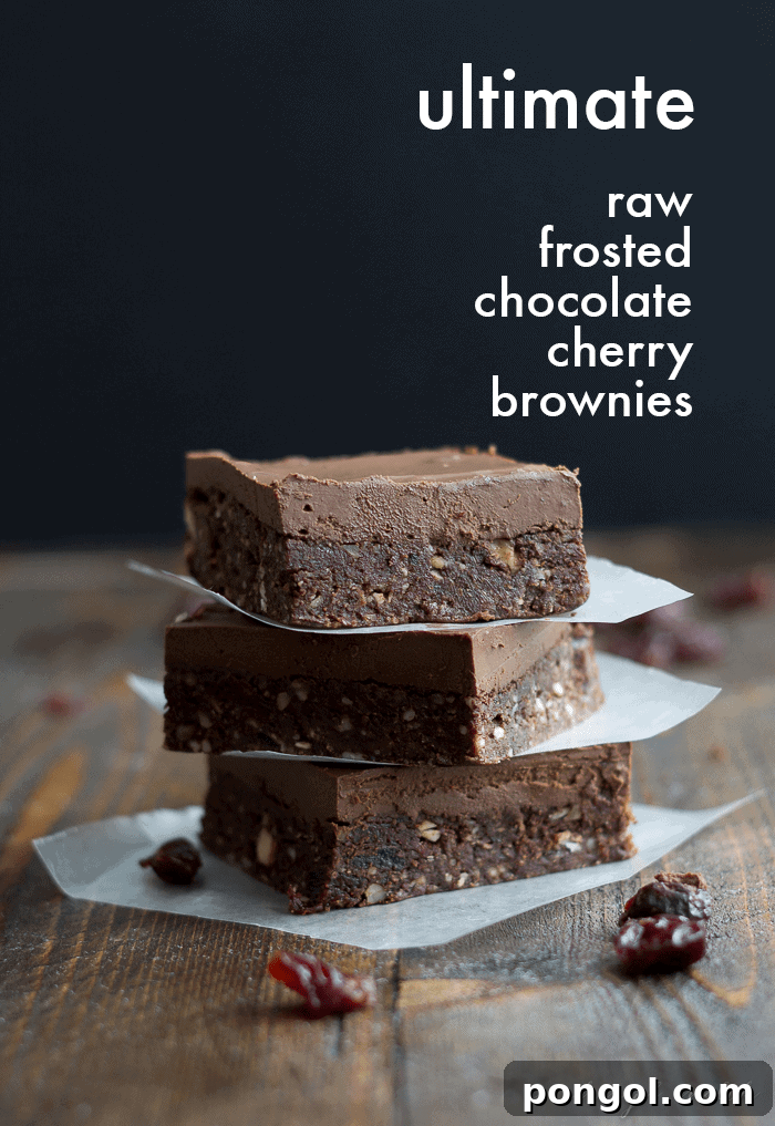 Rich and fudgy Raw Frosted Chocolate Cherry Brownies, a perfect no-bake dessert featuring sweet-tart cherries.