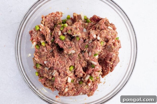 Meatloaf mixture in large glass mixing bowl