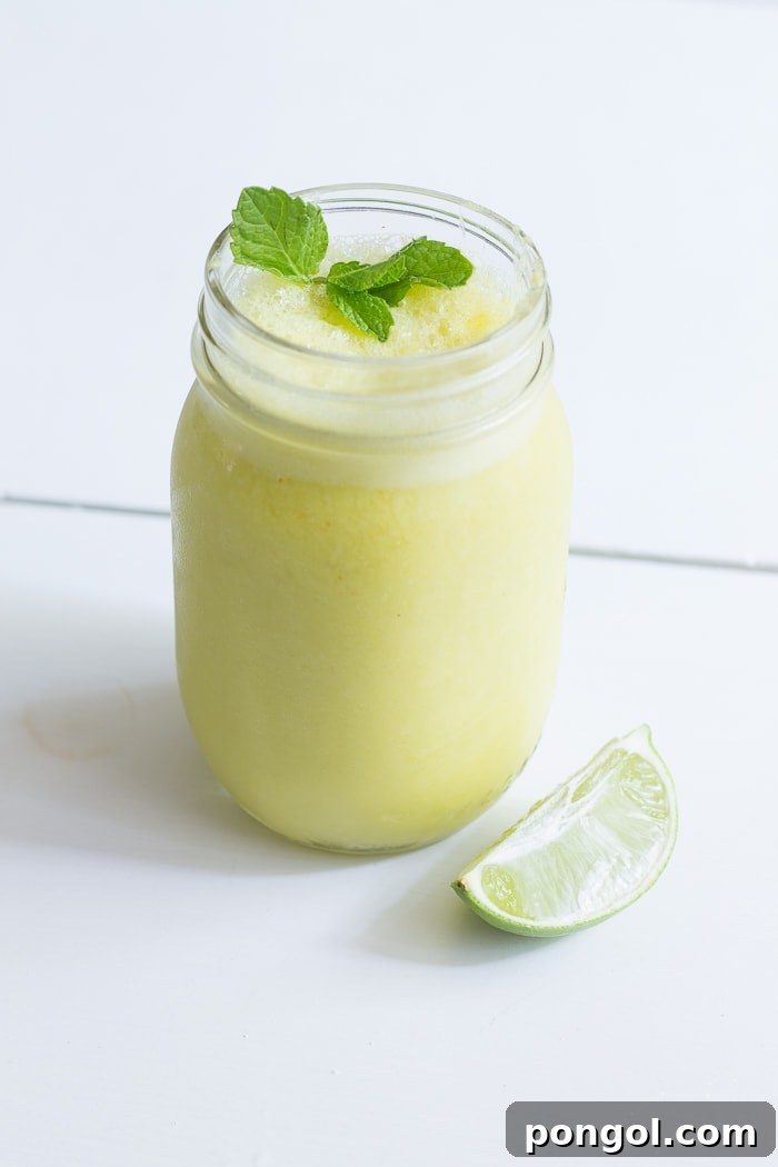 Close-up of a refreshing Mango Mojito Smoothie, perfect for summer.