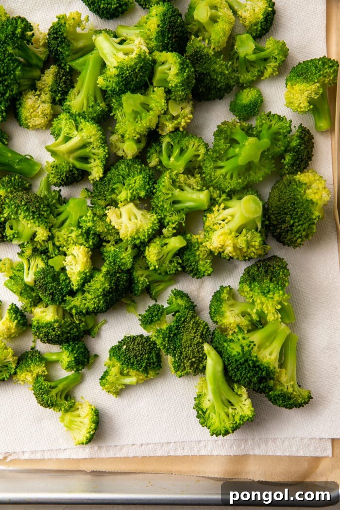 Fresh broccoli after cooking and drying, laying on a paper towel