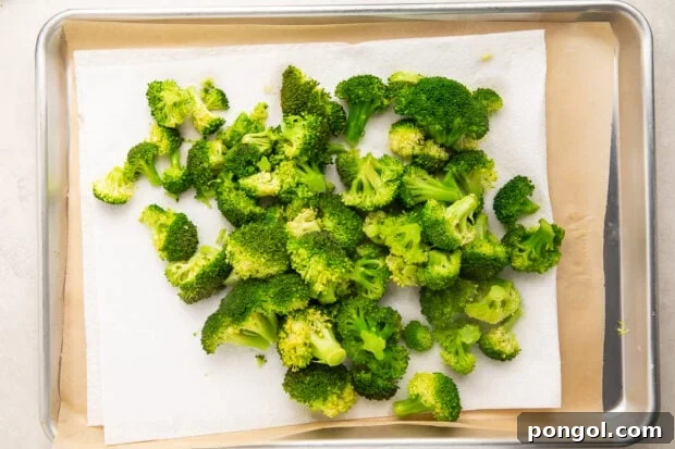Fresh broccoli after cooking and drying, laying on a paper towel