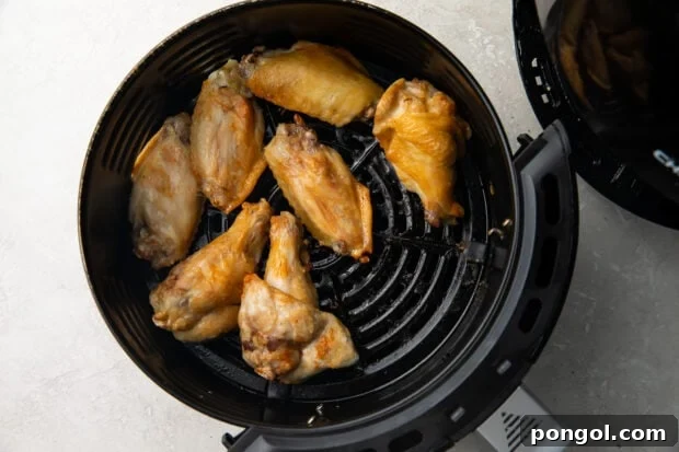 Ultimate Air Fryer Frozen Buffalo Wings 6 Air fryer chicken wings in air fryer basket