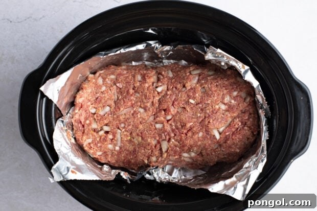 Slow cooker meatloaf in ceramic slow cooker insert