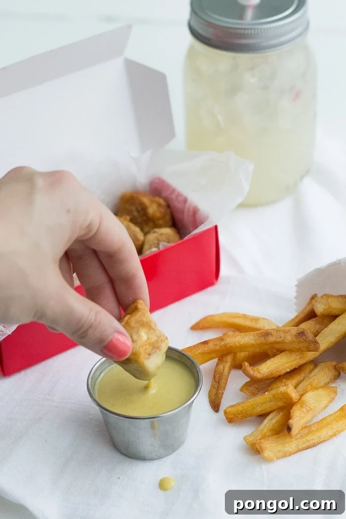 Close-up of crispy vegan tofu nuggets, marinated in pickle juice and breaded for a perfect Chick-fil-A copycat.