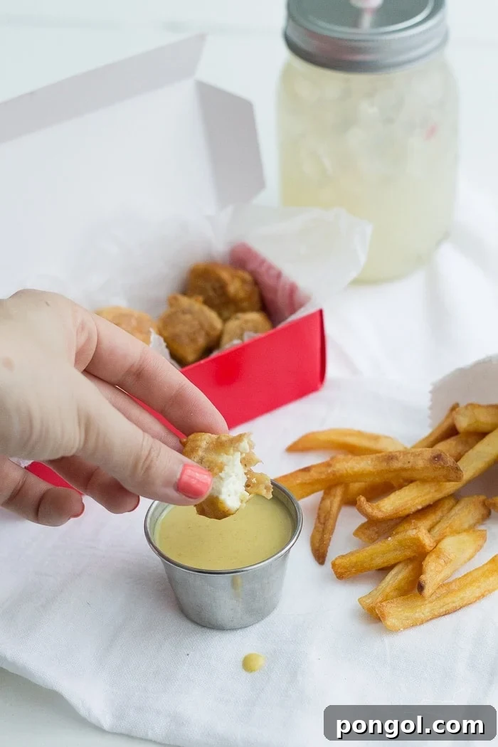 Freshly fried tofu nuggets ready to be dipped in homemade vegan honey mustard sauce.