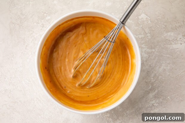 Copycat Chick-Fil-A sauce in a bowl with a whisk