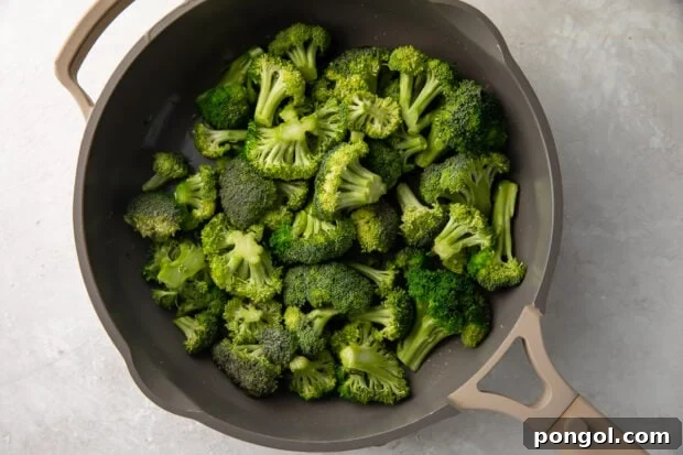 Sautéed Broccoli Florets 5 Sauteed broccoli in a large grey skillet