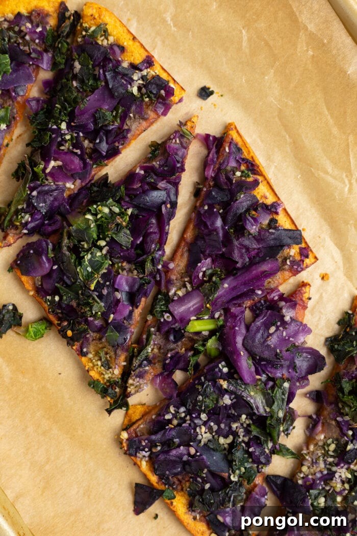 Daily Harvest: Embracing Autumn with Organic Eats 8 Daily Harvest sweet potato and kale flatbread, cooked and cut on a sheet of parchment paper