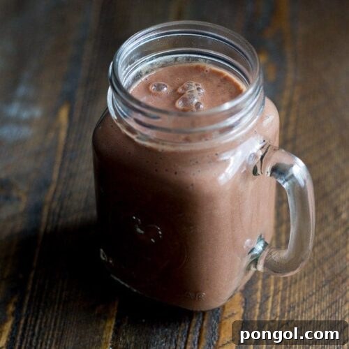 Delicious Chocolate Raspberry Maca Smoothie ready to be enjoyed.