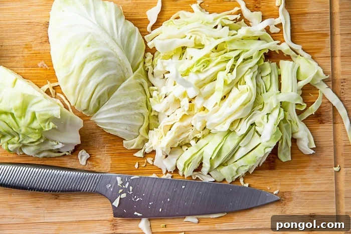 Your Ultimate Guide to Freezing Cabbage 3 How to shred cabbage with a large knife on a chopping board