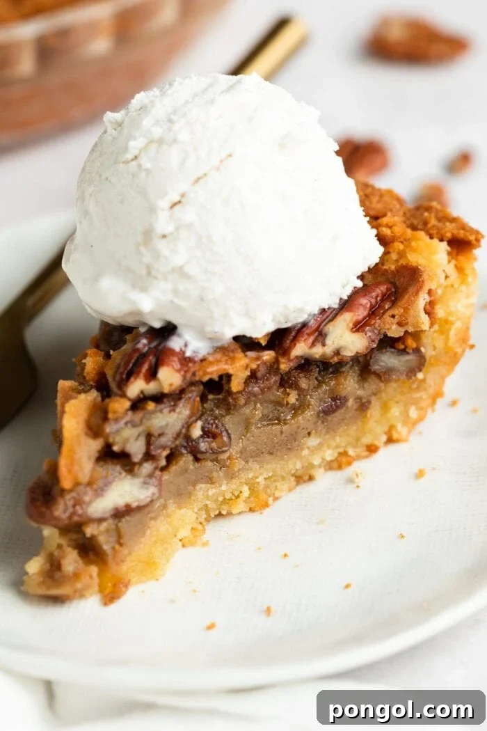 Decadent Keto Pecan Pie 3 slice of keto pecan pie on a plate with sugar-free vanilla ice cream on top