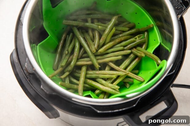 Instant Pot green beans in steamer basket after cooking