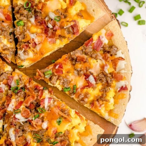 Overhead shot of breakfast pizza cut into slices on a wooden pizza board