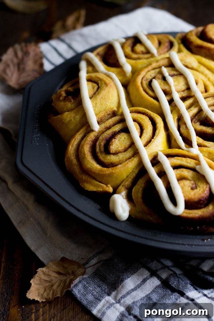 Vegan pumpkin cinnamon rolls with a maple-cream cheese glaze - simplified and ready in about 2 hours, these are the perfect fall breakfast