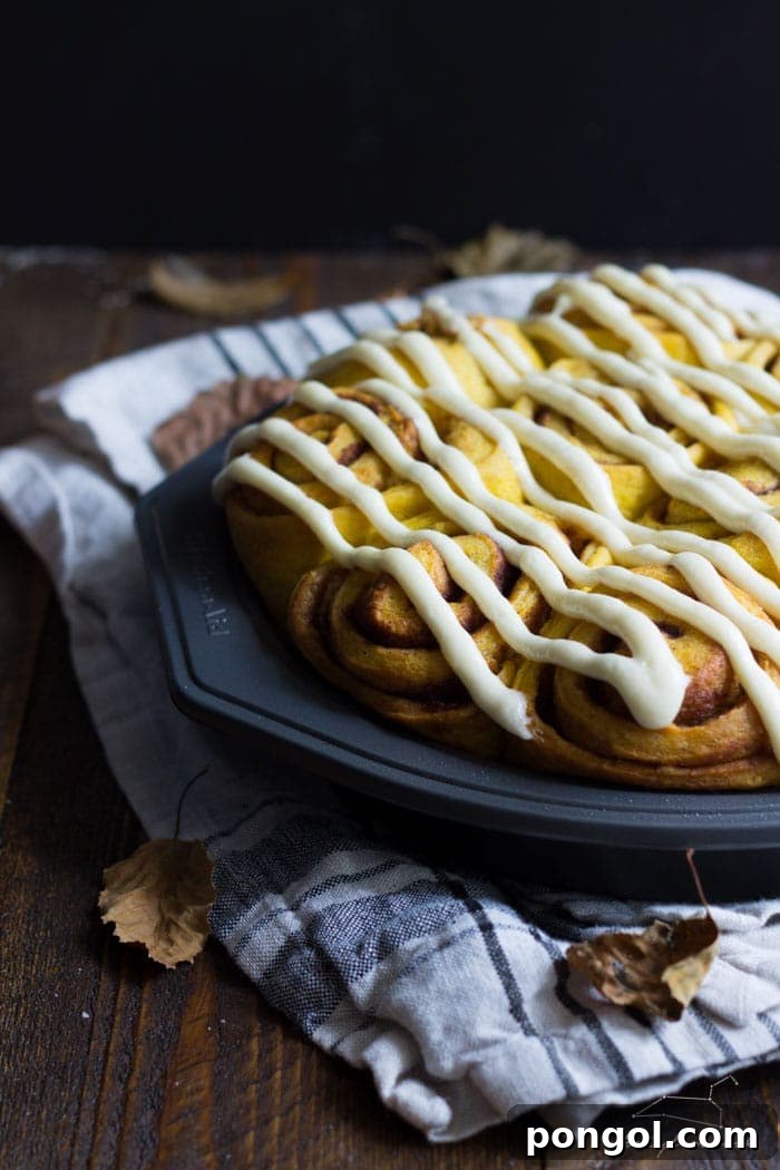 Vegan pumpkin cinnamon rolls with a maple-cream cheese glaze - simplified and ready in about 2 hours, these are the perfect fall breakfast
