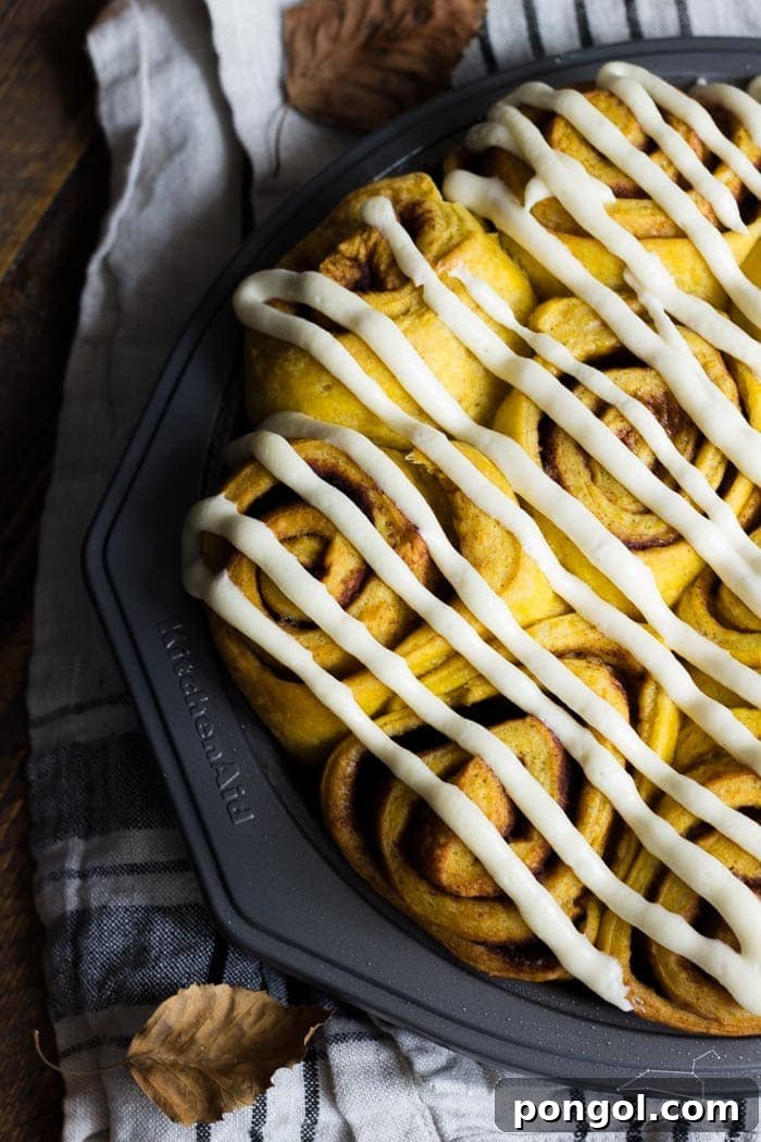 Vegan pumpkin cinnamon rolls with a maple-cream cheese glaze - simplified and ready in about 2 hours, these are the perfect fall breakfast