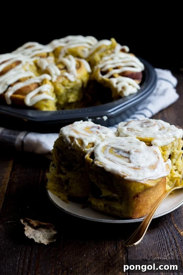 Vegan pumpkin cinnamon rolls with a maple-cream cheese glaze - simplified and ready in about 2 hours, these are the perfect fall breakfast