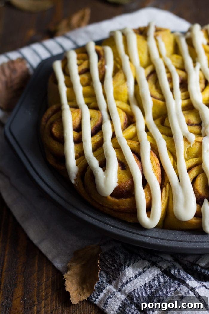 Vegan pumpkin cinnamon rolls with a maple-cream cheese glaze - simplified and ready in about 2 hours, these are the perfect fall breakfast