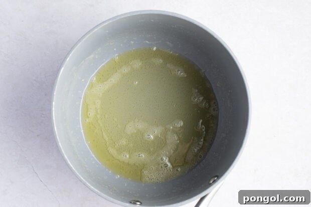 Melted butter pooled in the bottom of a medium saucepan, gently bubbling over heat.
