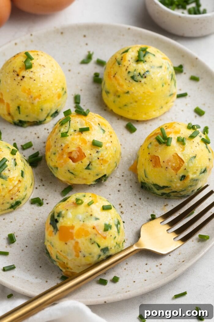 instant pot egg bites on a plate with fresh chopped chives on top