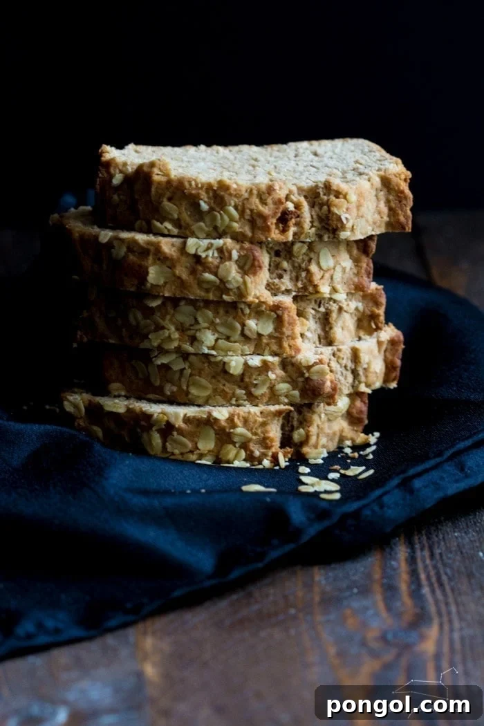 A light, airy slice of whole wheat beer bread, showing its texture