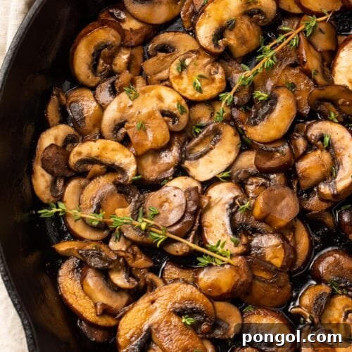 Sauteed mushrooms in a cast iron skillet, ready to serve.