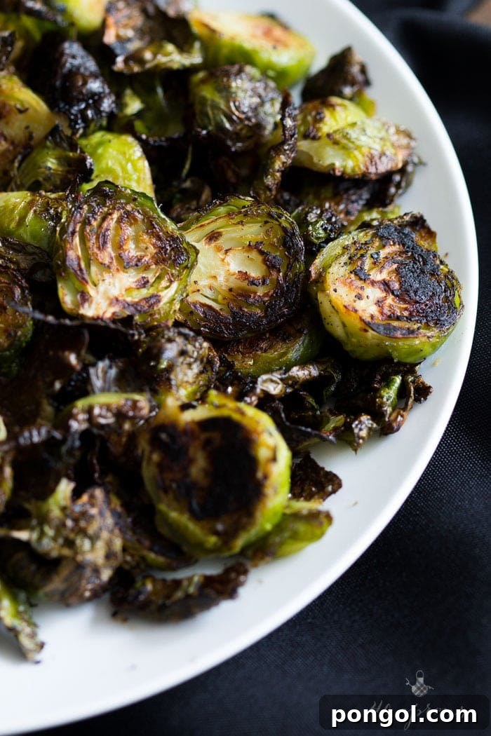 Crispy miso roasted brussel sprouts - in a miso, white wine, and butter sauce, these brussel sprouts are crazy good and so simple! Perfect for Thanksgiving