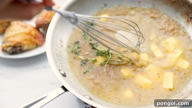 Whisk in cubed butter and herbs.