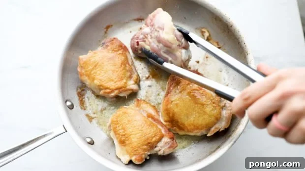 Flip chicken thighs.