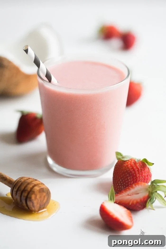 A beautifully rich Strawberries and Cream Smoothie, blending three simple ingredients for a perfectly indulgent and fresh taste. Photographed by 40 Aprons.
