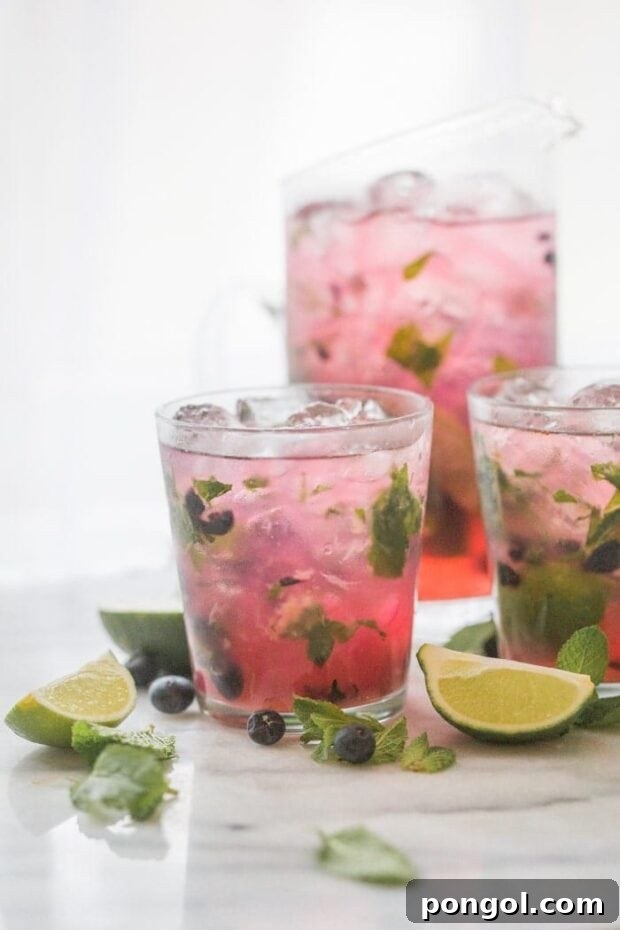 Party-Perfect Blueberry Mojitos 2 Blueberry Mojitos for a Crowd - perfectly light, minty, fruity and easy // 40 Aprons