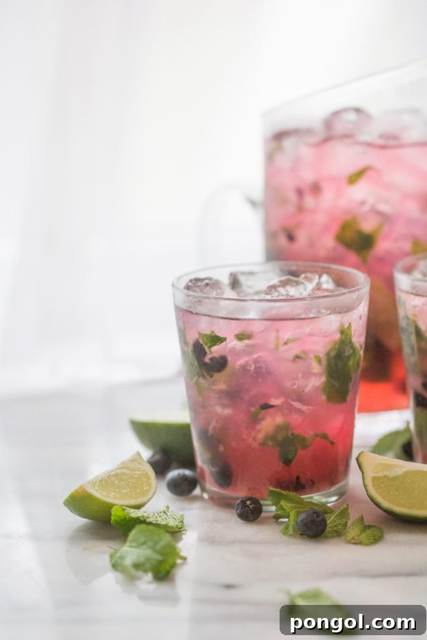 Party-Perfect Blueberry Mojitos 7 Blueberry Mojitos for a Crowd - perfectly light, minty, fruity and easy // 40 Aprons