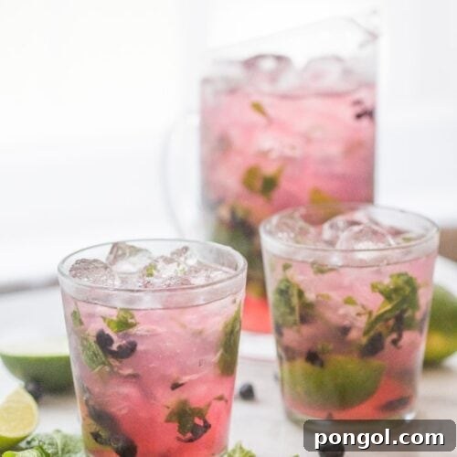 Party-Perfect Blueberry Mojitos 9 Blueberry Mojitos for a Crowd - perfectly light, minty, fruity and easy // 40 Aprons