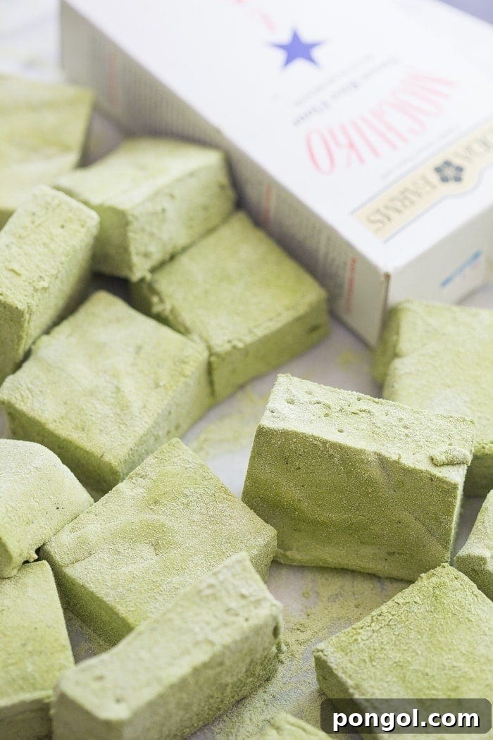 Close-up of fluffy Matcha Marshmallows, highlighting their vibrant green color and soft texture.